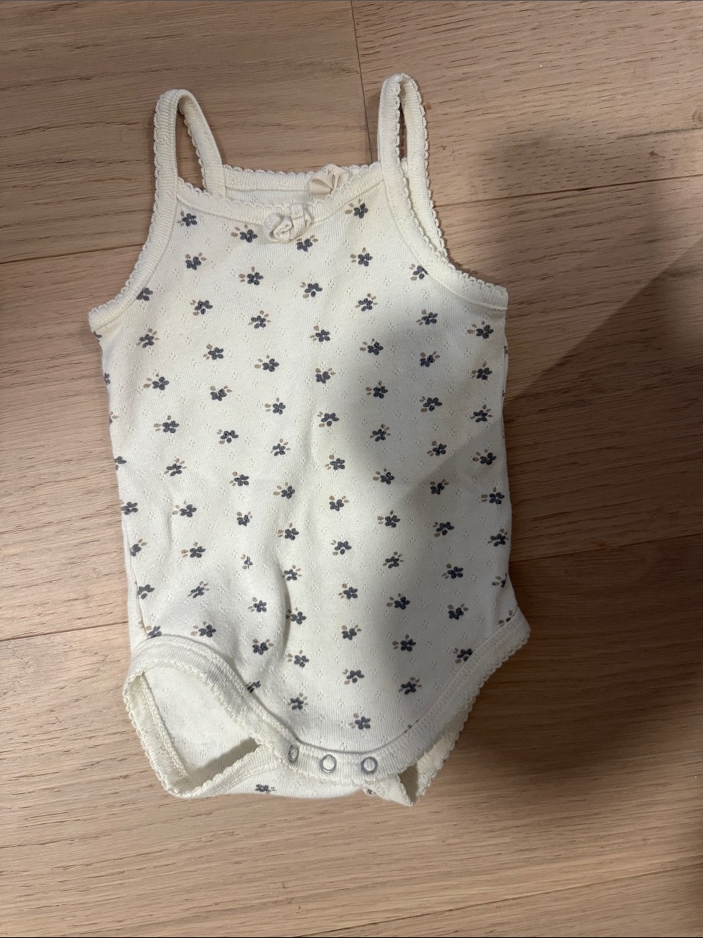 Quincy Mae Cream One-Piece Bodysuit with Navy Floral Print